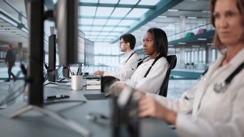 Medical Team Doing Bill Coding And Billing Codes Spreadsheets