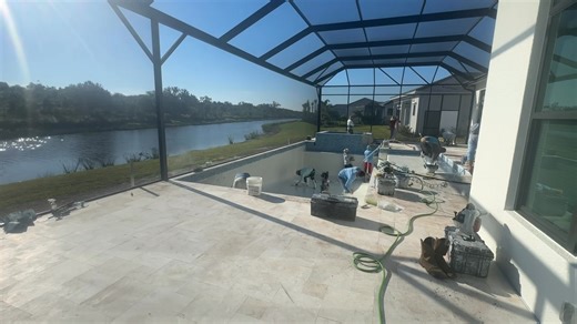 #ElysianPools installing #Stonescapes Interior Finish Aqua Cool color in Artistry Sarasota | Elysian Pools