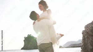 A guy lifts a girl by the waist. High quality FullHD footage