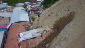 Aftermath of landslide in Peruvian Andes that buried dozens of homes