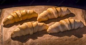 Time lapse video of the process of baking a group of croissants in the oven. Stock Video