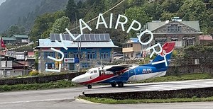 Lukla Airport, officially known as Tenzing-Hillary Airport, is a small airport in the town of Lukla in the Khumbu region of eastern Nepal. It is often considered one of the most dangerous airports in the world due to its challenging terrain, short runway, and unpredictable weather conditions. Here are some key points about Lukla Airport: 1. Location: Lukla, Nepal, at an elevation of 2,845 meters (9,334 feet) above sea level. 2. Runway: The runway is 527 meters (1,729 feet) long and has a gradien