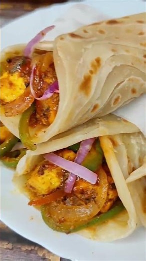 Soft roti filled with spicy, juicy paneer stuffing, loaded with fresh veggies and flavorful sauces 🌯