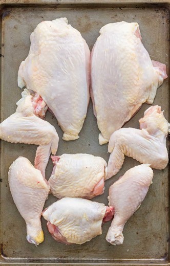 Cutting a whole chicken is easier than you might think! Watch: https://natashaskitchen.com/how-to-cut-whole-chicken-video/ | NatashasKitchen.com