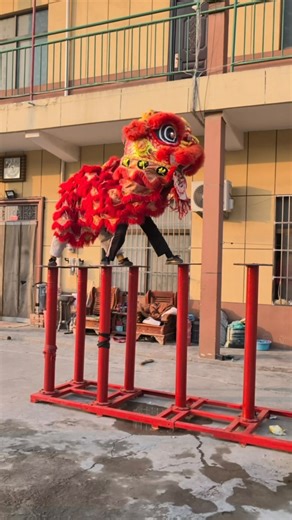 Art Viral 🎨 on Instagram: "This troupe performs high-pole dragon dance, one of the most physically demanding traditions in Chinese performance. Dancers jump, pivot, and balance on narrow poles rising several meters above the ground, relying completely on strength, coordination, and trust. Without the dragon costume, the choreography appears stark and almost mechanical, driven by sheer athletic control. Once the dragon is lifted into place, those same precise movements merge into a soarin