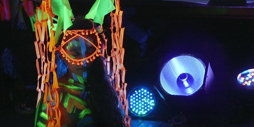 This life drawing class uses UV lighting and neon crayons to create amazingly colourful artwork