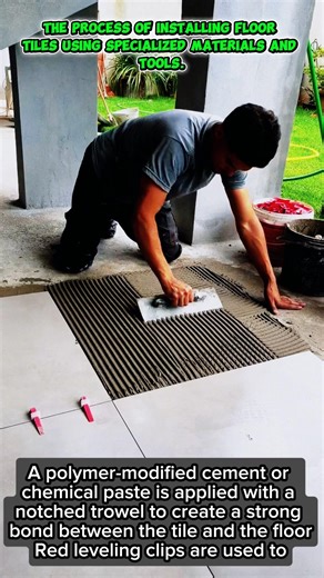 The process of installing floor tiles using specialized materials and tools.