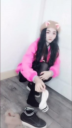 she takes off her shoe to show off her white socks