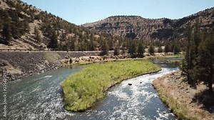 Flight in the high desert of central Oregon over premier flyfishing trout stream in the crooked river canyon