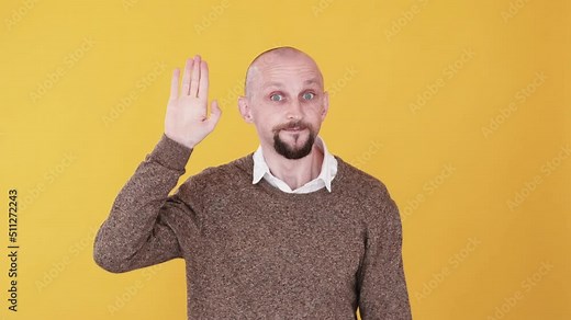 Bye gesture. Leaving farewell. See you. Boomerang animation. Friendly smiling funny man waving hand goodbye gif loop isolated on orange empty space background.