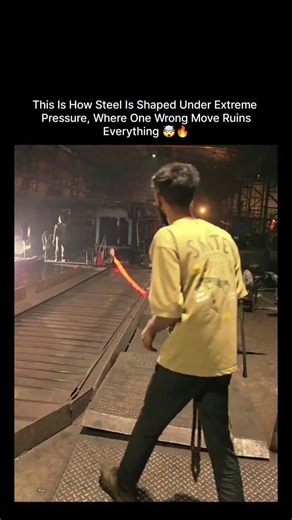 World_War on Instagram: "This video showing depicts workers in a steel rolling mill handling hot metal stock as part of the manufacturing process. A steel mill is an industrial facility where raw materials are processed into steel products. The process involves deforming metal stock through a series of rolls, often at high temperatures (hot rolling). The high temperature makes the metal glow red-hot, as seen in the image, allowing it to be shaped. The goal is to reduce the thickness of the metal