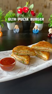 Ulta Pulta Burger Recipe ⬇️ *RECIPE* 1. In a bowl take 2 boiled mashed potatoes. Add some chopped green chilli, 1 tbsp chili flakes, 1 tbsp oregano, 1 tbsp salt, 1 tbsp garam masala and coriander leaves. 2. Mix all together. 3. Take a bread slice. Cut into circle. 4. Spread the tomato ketchup and put cheese. 5. Top it with another circle shaped bread and press so that it will stick. 6. Take small portion of the potato stuffing and cover the bread as shown. 7. Dip into slurry (2 tbsp corn flour, 