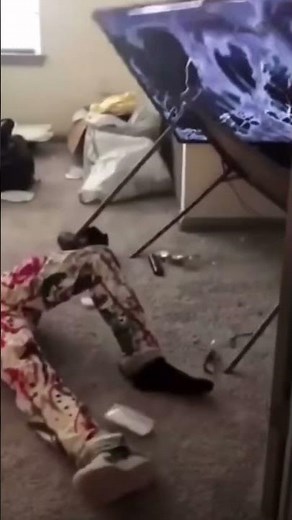 Guy drop kicks his tv