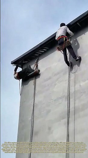 Rope Access Mounting: A Painter Climbs Onto Suspended Scaffold For Exterior Wall Work