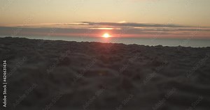Sunset of the island Sylt with the sandy beach in the foreground
