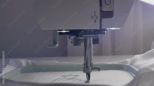 Machine embroidery work.Working embroidery machine. Textile - Professional and industrial embroidery machine. Needle moves quickly, embroidering a pattern