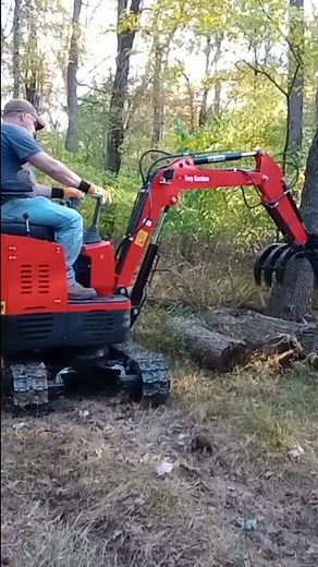 Gardner's GroundHog Excavator using New Log Grapple.