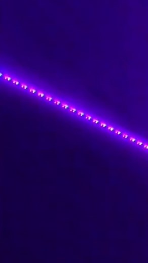 Purple LED Light Strip on Dark Background