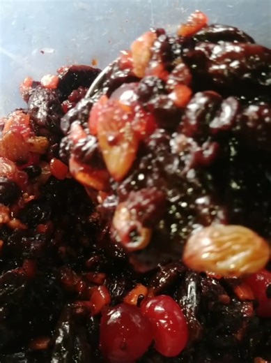 Fruit Cake Preparation: Grinding Fruits for a Delicious Treat