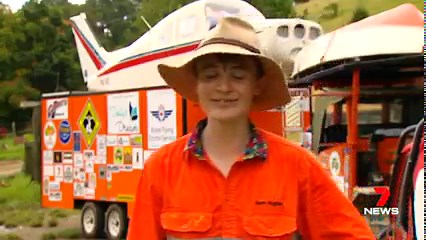 Remember The Travelling Jackaroo? Last time 7NEWS met 18-year-old Sam Hughes he was preparing to set out on a trip around Australia on his vintage tractor. This Sunday he finally hits the road in his 1957 Chamberlain 9G, towing a trailer with a motorbike on board, a car inside and a boat and plane on top. He'll roll into outback towns across Queensland before heading further west, fundraising for Dolly's Dream and the Royal Flying Doctor Service of Australia. "The thing that excites me the most 