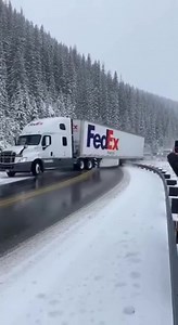 FedEx Truck Crashes Through Guardrail, Rolls Down Snowy Mountain Slope 🏔️❄️ Vail Pass, Colorado — Friday, February 28, 2025 Footage recorded on a snowy Colorado mountain pass shows a FedEx semi-truck losing traction on black ice while rounding a curve. The vehicle slides into a guardrail, breaks through it, and rolls down a steep embankment into the trees below, kicking up snow and debris as it descends. Authorities confirmed emergency responders arrived quickly. No further details were release