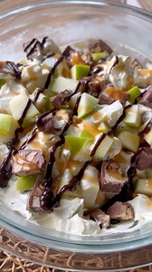 Not your typical salad… this one’s a sweet treat! 🍏🍫 Snickers Salad: • 1 box (5.1 oz) vanilla instant pudding mix • 1 cup cold milk (or per package directions) • 1 container (8 oz) Cool Whip • 3–6 @snickers candy bars, chopped • 3 Granny Smith apples, chopped (more or less depending on size) • Caramel & chocolate syrup for topping Mix pudding with milk until smooth. Fold in Cool Whip. Stir in chopped candy bars and apples. Drizzle with caramel & chocolate syrup. So good, y’all! #sweet #dessert