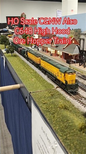 HO Scale C&NW Alco C648 High Hood Ore Hopper Train Passes Station!