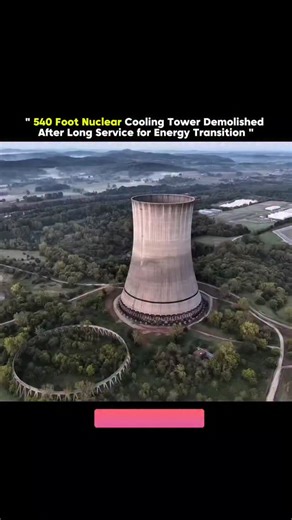 axisrnx18M on Instagram: "The video captures the dramatic controlled demolition of a 540-foot nuclear cooling tower, a massive concrete structure that once served as a landmark for a power facility. The footage begins with a wide aerial shot of the tower standing in a lush, wooded landscape, with the first sequence showing a series of quick, sequential explosions at its base. As the charges detonate, a ring of dust and debris erupts from the support columns, and the massive structure begins its 