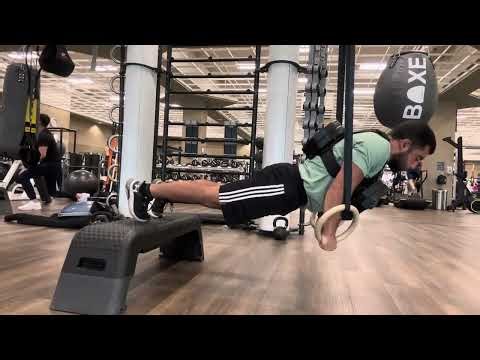 weighted Ring push ups (7 reps 40 lbs)