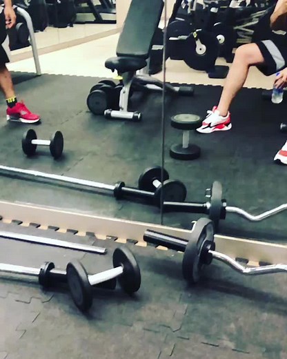 Bottle Flipping Challenge in a Gym Setting