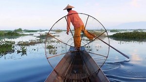 The second biggest lake in the country, Inle Lake is a reflective, freshwater beauty of nature found in the Shan Hills. While the lake itself is wonderful to look at, the fisherman are what really catch your eye. Each of them stands inside a wooden boat balanced on one leg while wrapping their other around the oar to row. This technique frees up both their hands to maneuver the fishing net and allows them to see potential catches from a higher vantage point. | Visit Southeast Asia