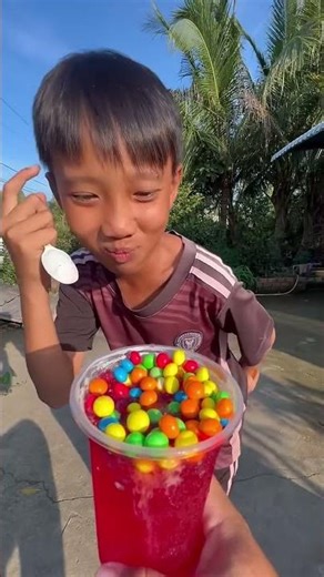 A cup of red ice cream and lots of candy balls #shorts