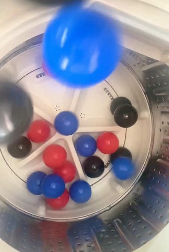 Satisfying Experiment with Balls in a Washing Machine