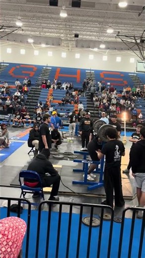 Squatting 485lb at powerlifting meet.