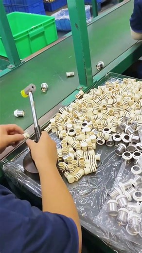 Manual Assembly of Metal and Plastic Components on a Production Line
