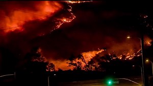 Evacuations underway as wildfire sweeps into northern Los Angeles