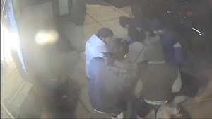 Surveillance video shows suspect firing at off-duty officer breaking up fight outside West Philly bar