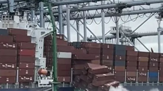 Shocking moment more than 60 shipping containers tumble off cargo ship