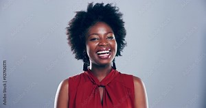 Black woman, laughing and happy with comedy, funny and joke for comic, meme and on studio background. Humour, face and smile for good mood, enjoy and carefree with freedom, goofy and silly mindset