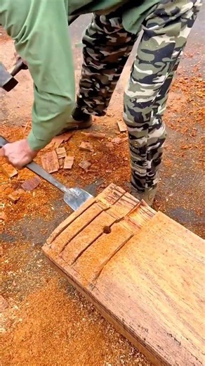 Manual technique for drilling and shaping wood using a chisel and hammer #shorts