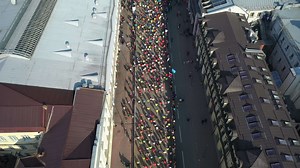 Download Aerial view of marathon runners on the streets of Kyiv Ukraine