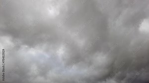 Cumulus clouds moving fast in the dark stormy sky, timelapse Stock Video