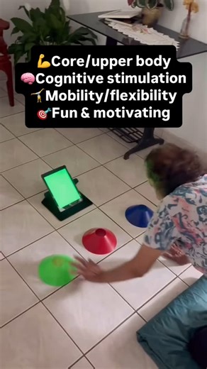 Cognitive-motor exercises like this one offer powerful physical and brain health benefits for older adults, including: . 💪 Core & Upper Body Strength – Reaching for the cones activates the shoulders, abs, and lower back. . 🧠 Cognitive Stimulation – Randomized colors stimulate memory, attention, and processing speed. . 🤸 Mobility & Flexibility – Placing cones farther away helps strengthen and lengthen key muscles. . 🎯 Fun & Motivating – The interactive app experience keeps training engaging a