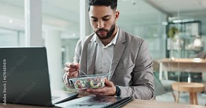 Man, eating and laptop at desk, typing and office with salad, technology and working lunch. Business person, email and report or deadline, internet and agenda for corporate, documents and overtime