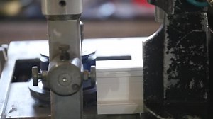 Fastening of a metal skeleton by means of self-tapping screws inside a plastic profile. PVC window production technology. Factory for PVC windows and doors production.