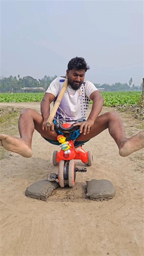 A Little boy is having fun with his bicycle?564