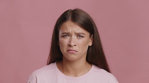 Shocked And Disgusted Woman Looking At Camera Expressing Negative Emotions Frowning And Shaking Head In Disapprovement Posing Over Pink Studio Background. Disgust And Shock Concept