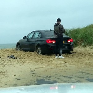 Guy Locked out of Car That's Still in Gear Stuck on the Beach