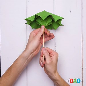 Come rain or shine, umbrellas are always useful to have. So here is a fun and engineering challenge: to make your own foldable umbrellas. Fold them up to keep toys out of the dreary weather or protected from the hot sun. Then fold them down, so they tuck nicely away. This cool craft is also useful in showing you the mechanics of how this everyday item works. So let’s make a foldable umbrella today! #TheDadLab #worldofengineering #engineeringproblems #papercraft | TheDadLab