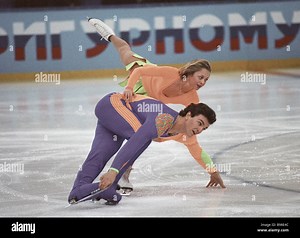 Figure skaters Elena Berezhnaya in overhead bird and Anton Sikharulidze on ice at Sokolniki Sports Palace Stock Photo - Alamy
